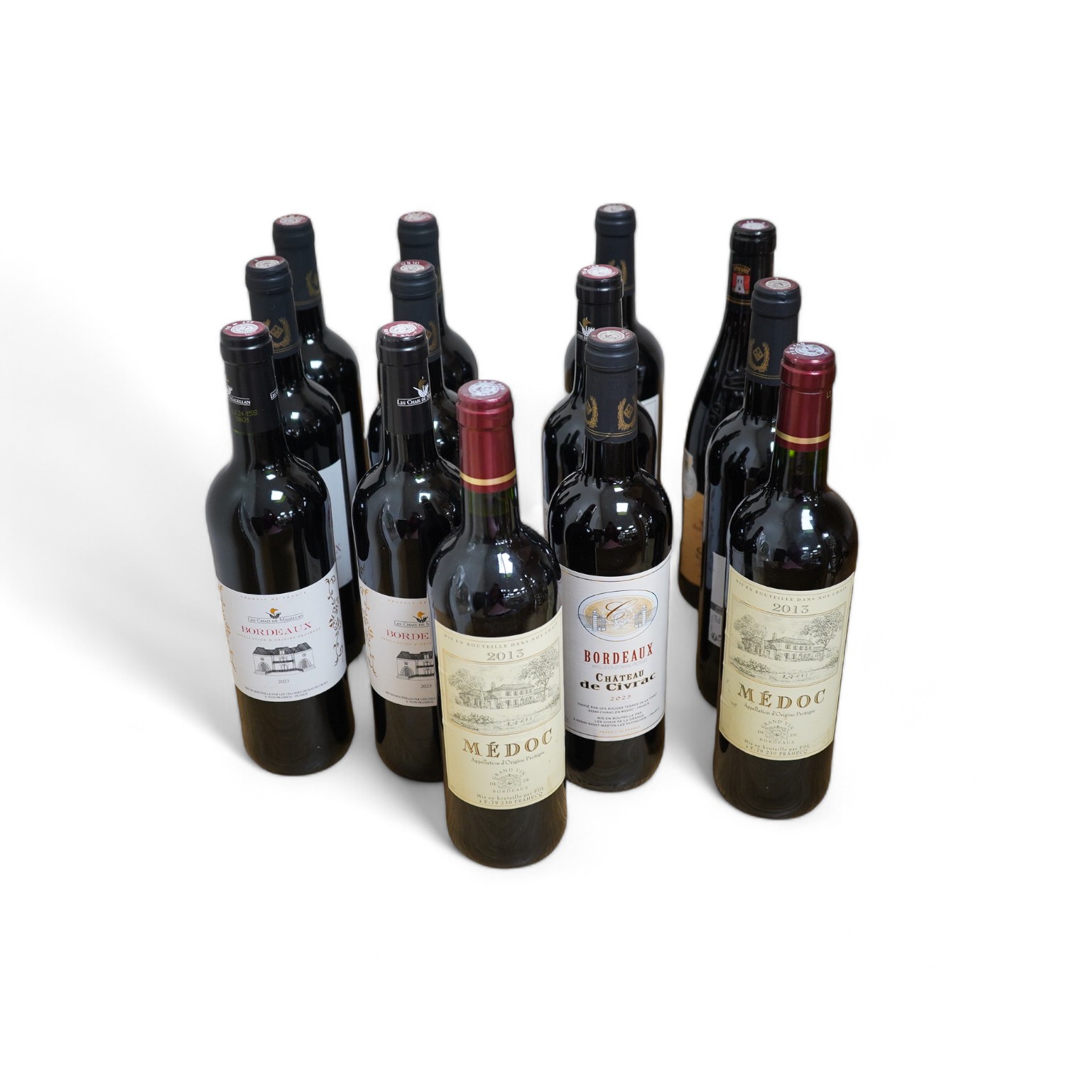 A group of thirteen bottles of various wines including Bordeaux Chateau de Civrac, Medoc Appellation d’Origine Protégée 2013, Les Chais De Magellan Bordeaux 2023, Excellence des Vignerons Sablet Cotes De Rhône Villages 2